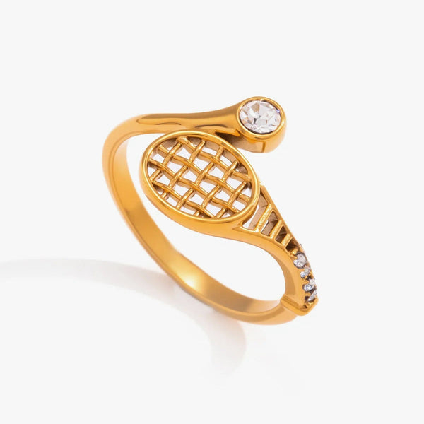 Gold-tone tennis racket ring with an open lattice head and a round crystal