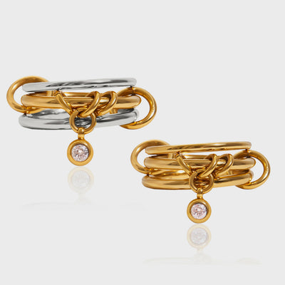 Linked triple-band rings with a small crystal drop