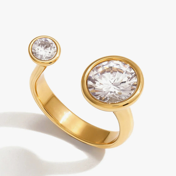 Open ring set with two round crystals of different sizes