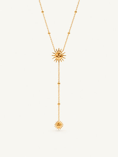 Y-shaped chain with a sun motif at the neck and a smaller sun drop