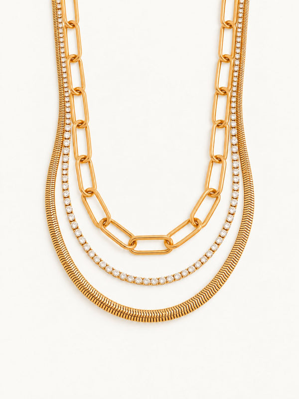 Layered snake, paperclip and crystal chains in gold tone