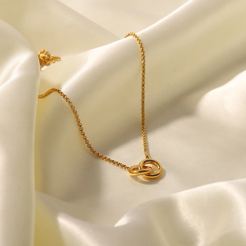 Close view of the linked circles pendant on cream satin