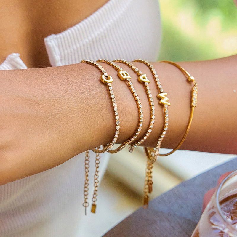 Pauline Initial Crystal Tennis Bracelet stacked, initial letters in view