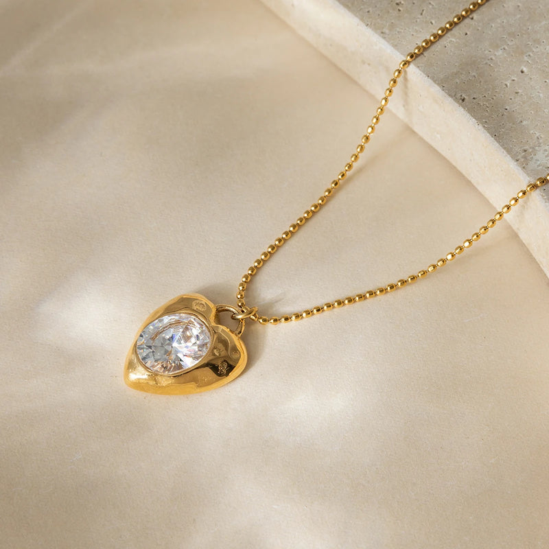 Cyrielle Crystal Heart Necklace laid flat, close-up of the heart pendant