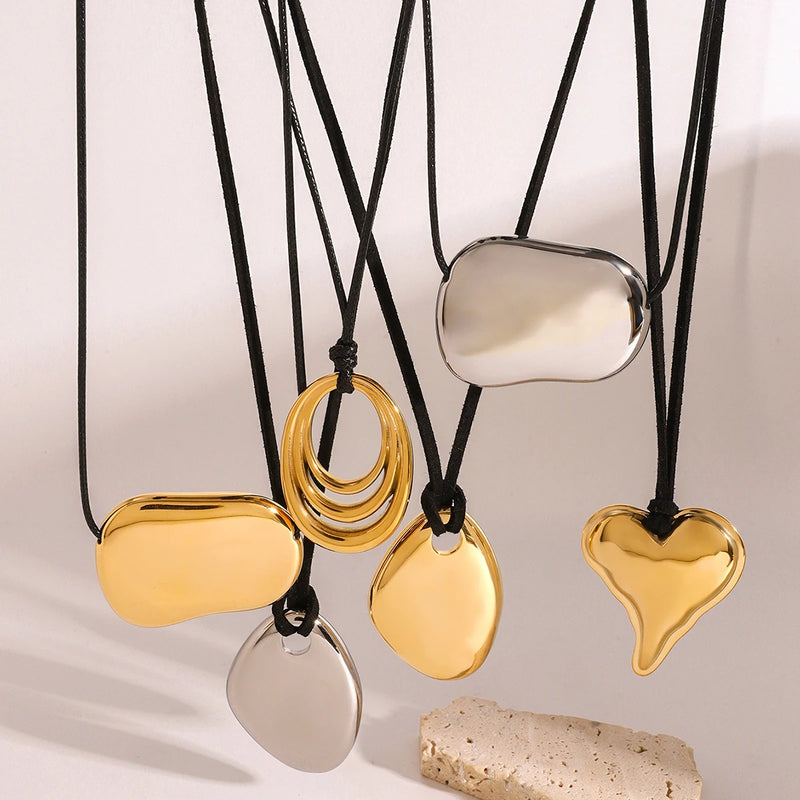 Several cord necklaces with pebble and heart pendants