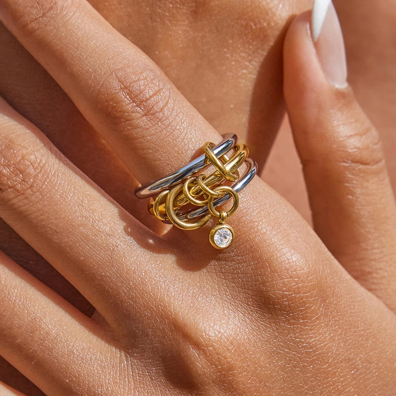 Close view of the linked triple-band ring worn on the hand
