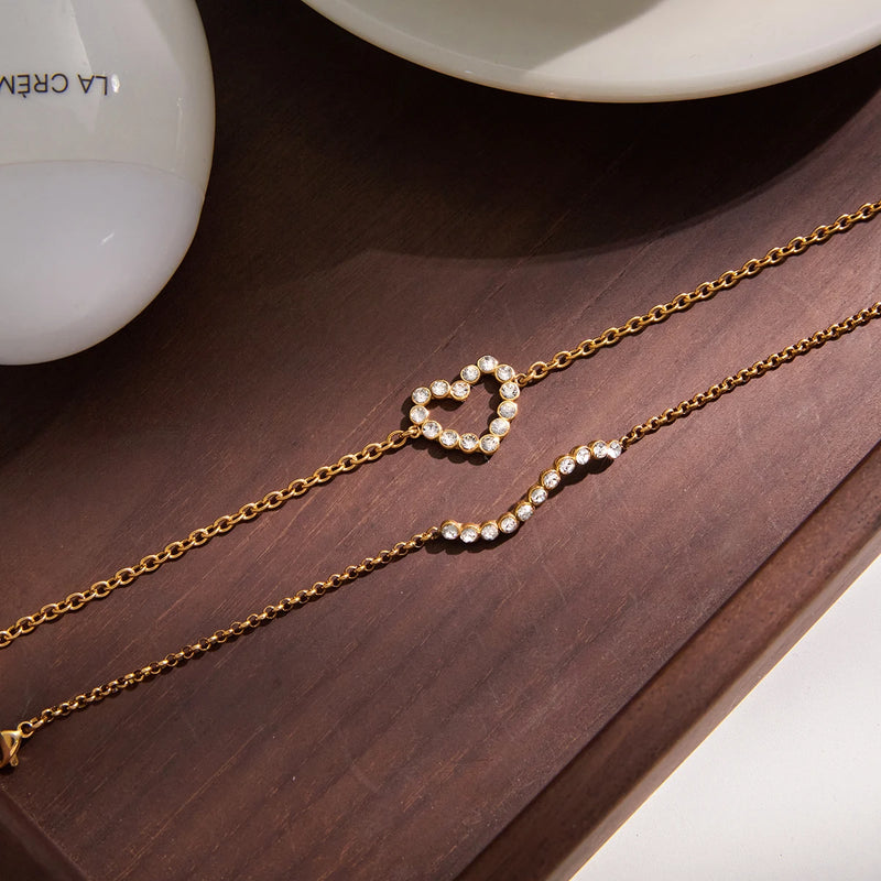 Close view of the crystal-set open heart on a fine chain