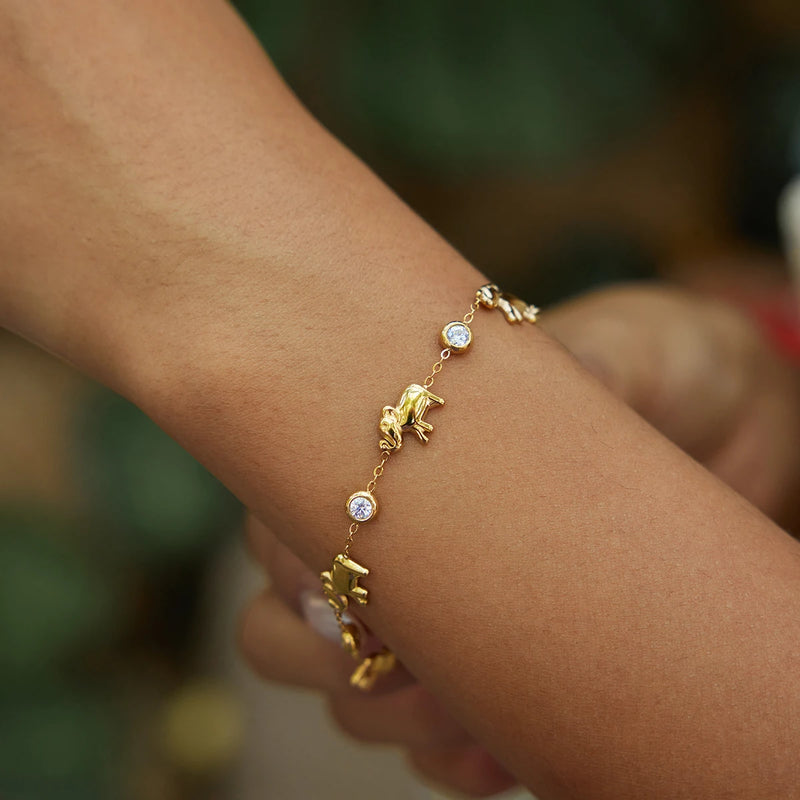 Elephant charm bracelet with crystals worn on a wrist outdoors