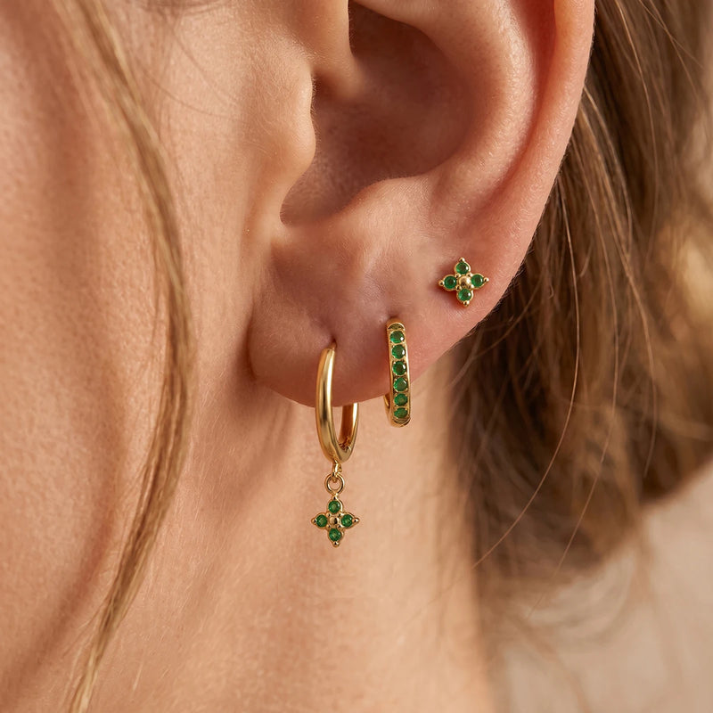Julienne Flower Trio Earrings worn on one ear, green stones