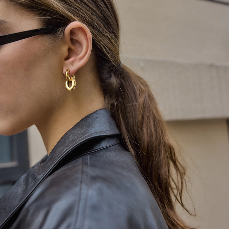 Side view of the double circle drop earring worn outdoors