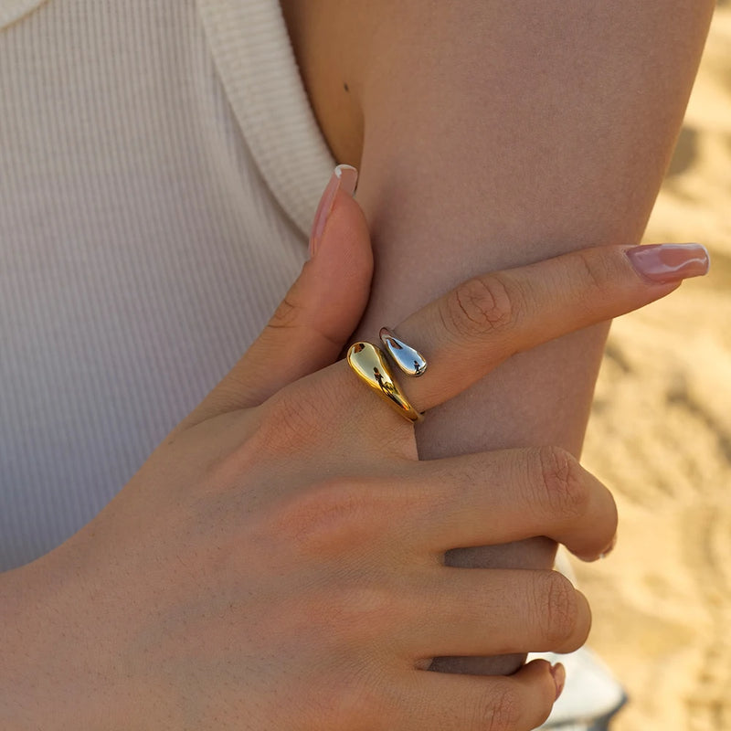 Two-tone wrap ring worn on a hand at the beach