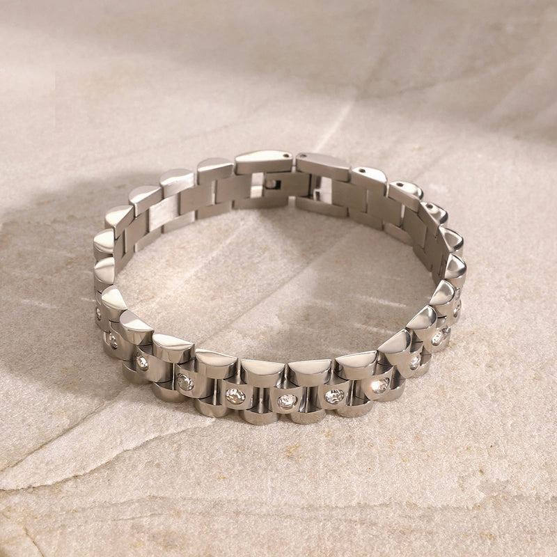 Silver-tone watch-link bracelet with small crystals, laid flat