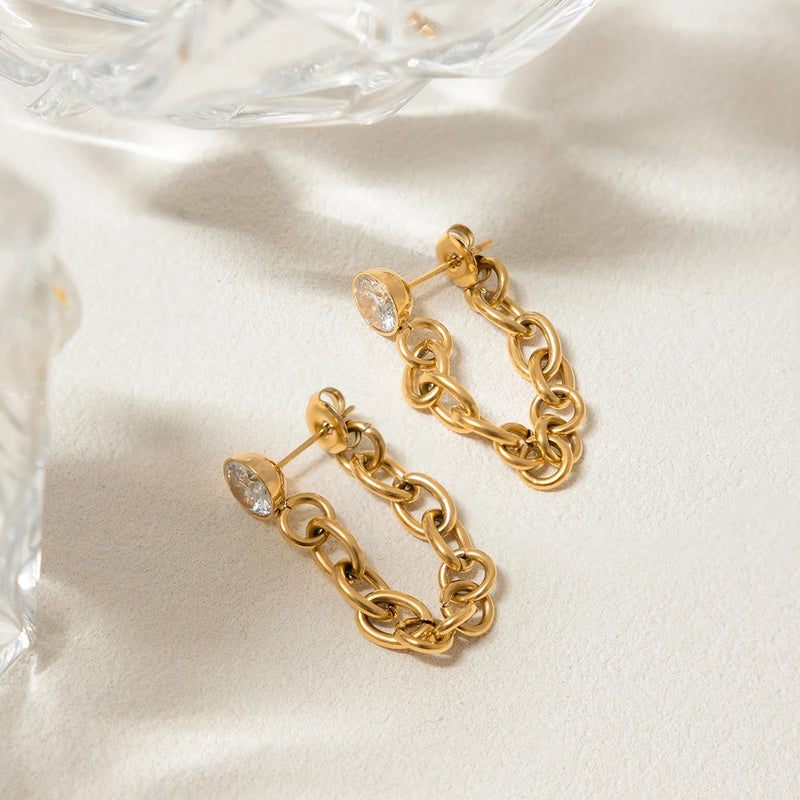 Pair of crystal chain drop earrings on cream satin