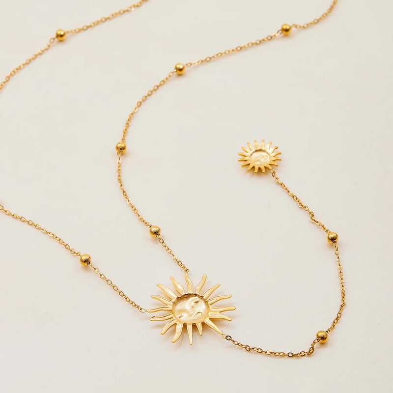 Close view of the sun charms along the beaded chain