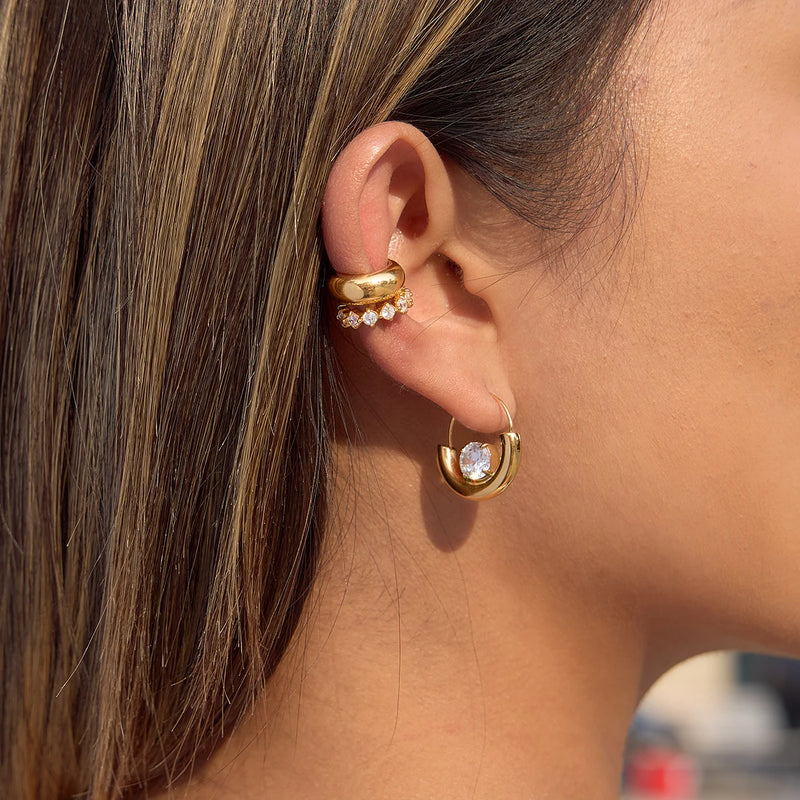 Crescent crystal hoop worn below an ear cuff