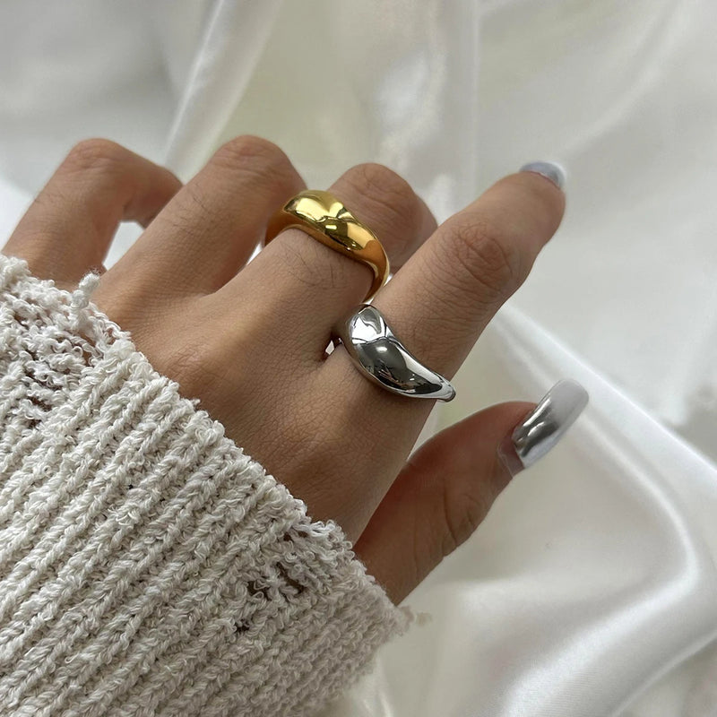 Ludivine Sculptural Wave Ring worn on adjacent fingers, both colourways