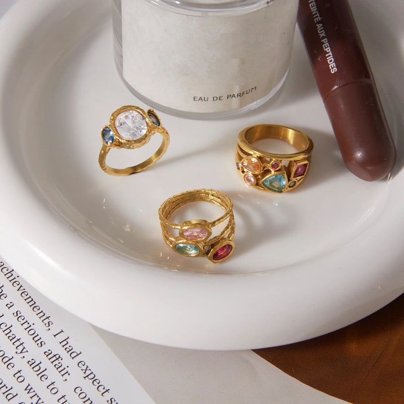 Aude Multi-Stone Ring, three designs on a white dish