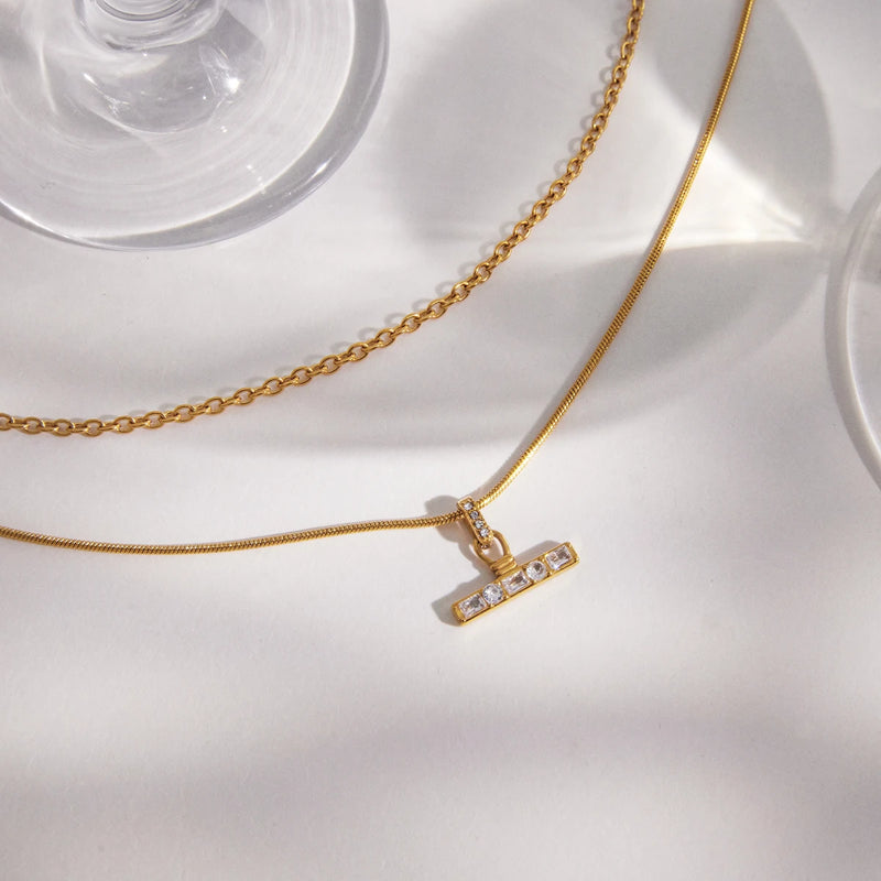 Fabienne Multilayer T-Bar Necklace laid flat, close-up of the T-bar pendant