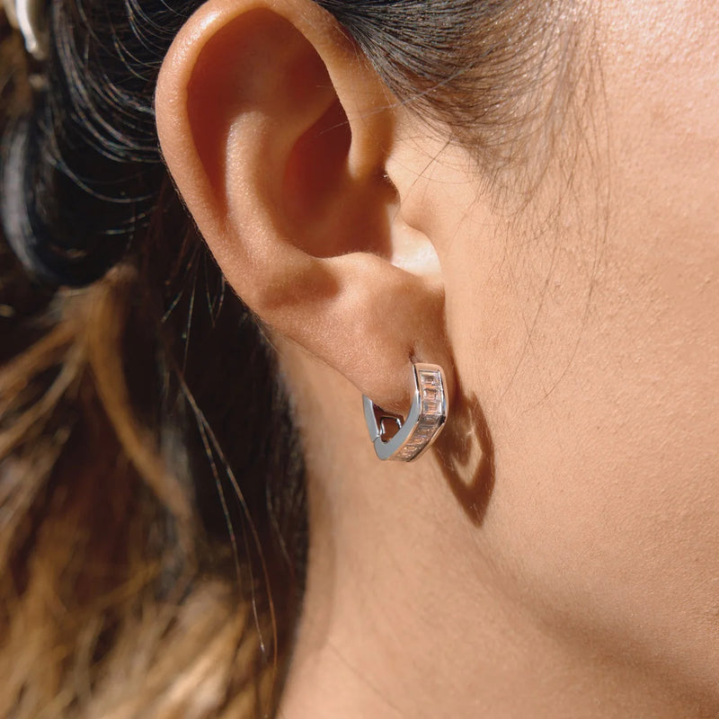 Baguette crystal huggie hoop worn on the lobe