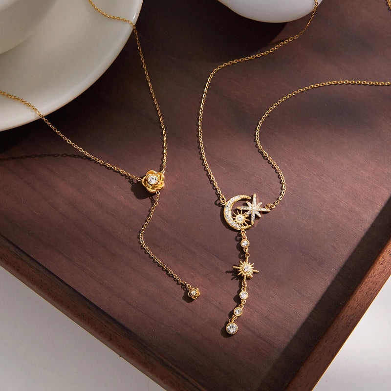 Angele Crystal Lariat Necklace draped on a wooden tray showing the full lariat drop