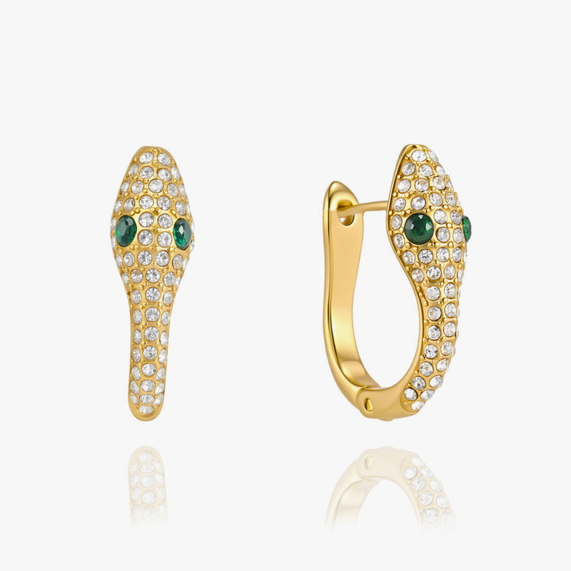 Snake-shaped hoop earrings covered in crystals with green stone eyes