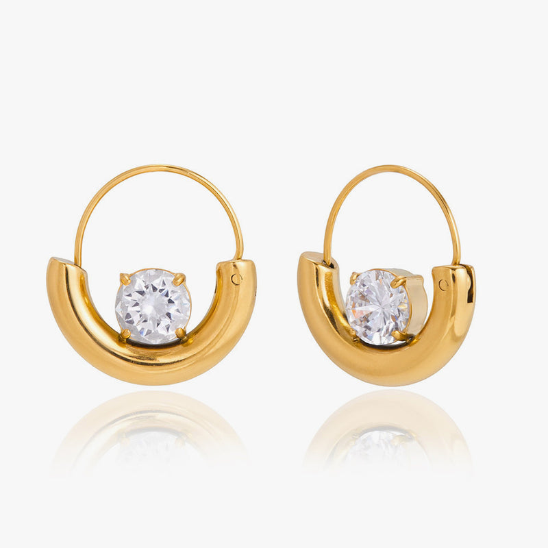 Half-moon hoop earrings each holding a single round crystal