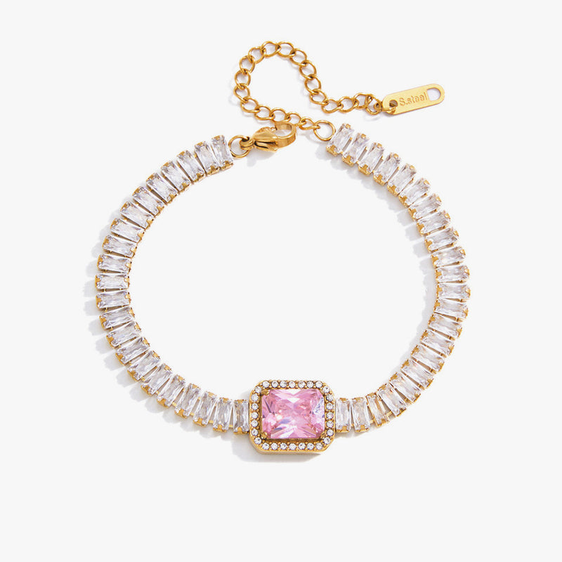 Baguette crystal tennis bracelet with a pink square stone at the centre