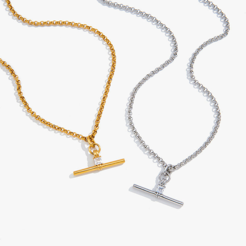 Two T-bar necklaces, one gold-tone bead chain and one crystal chain