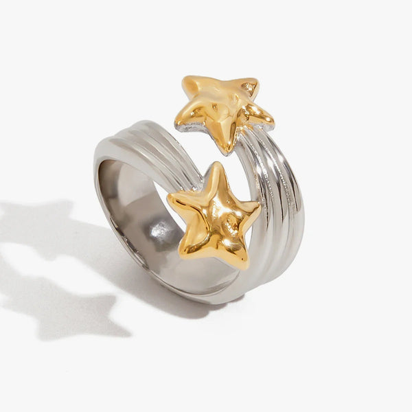 Ribbed silver-tone band ring topped with two gold-tone stars