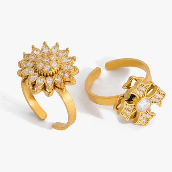 Open rings with a crystal-set flower and a crystal-set cross