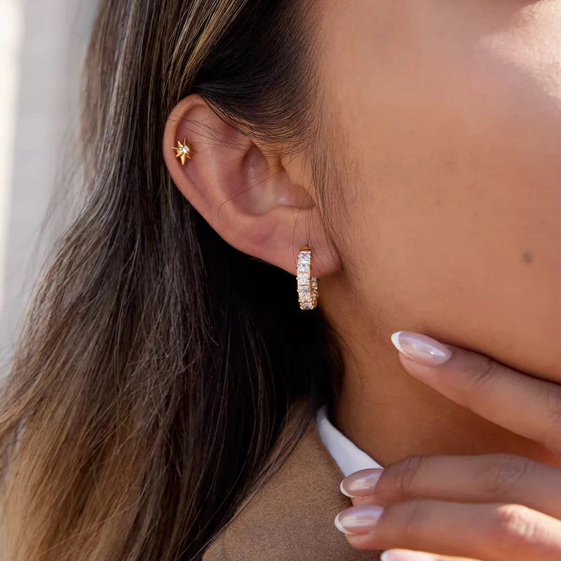 Square crystal huggie hoop worn on the lobe