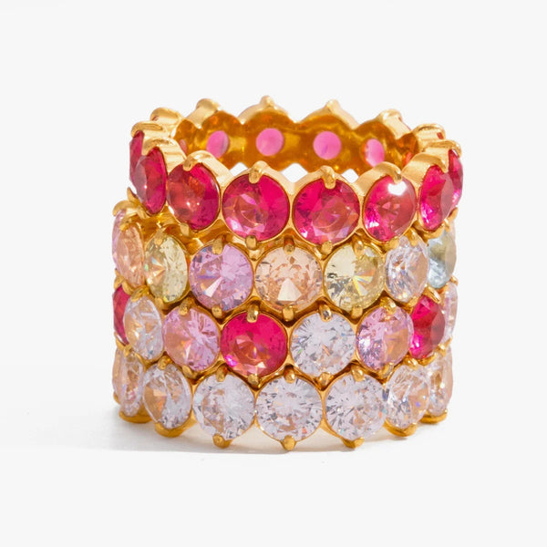 Stacked eternity bands set with pink, yellow and clear stones
