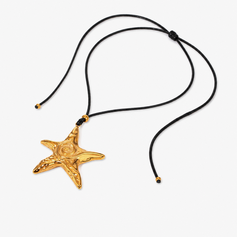 Gold-tone starfish pendant on an adjustable black cord