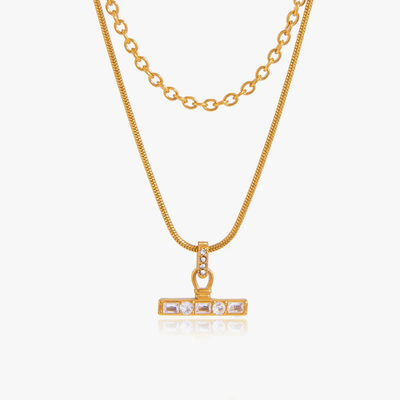 Two-strand gold-tone necklace with a crystal-set bar pendant
