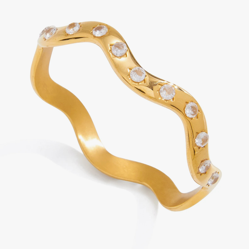 Wavy gold-tone cuff set with small clear crystals