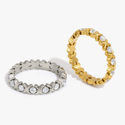 Eternity bands with crossed links and clear crystals, in silver and gold tone