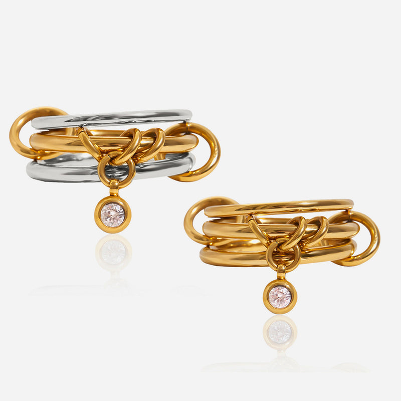 Linked triple-band rings with a small crystal drop