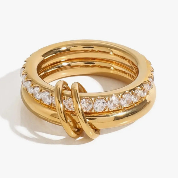 Two linked bands joined by a loop, one set with clear crystals