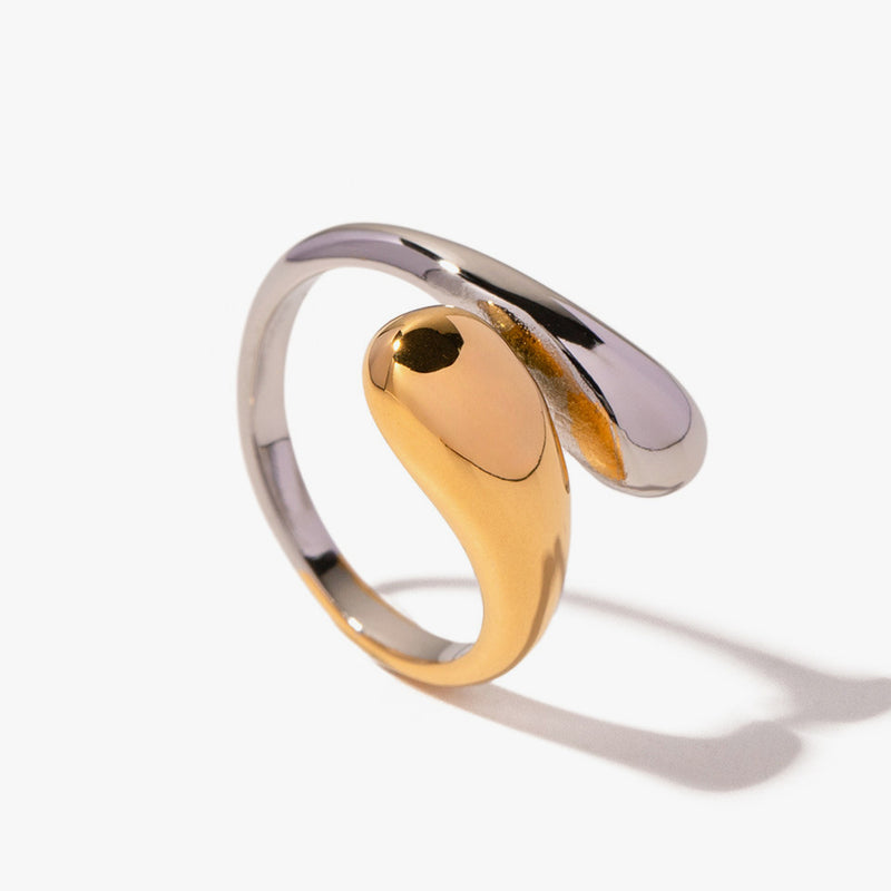 Swirled wrap ring blending gold tone and silver tone