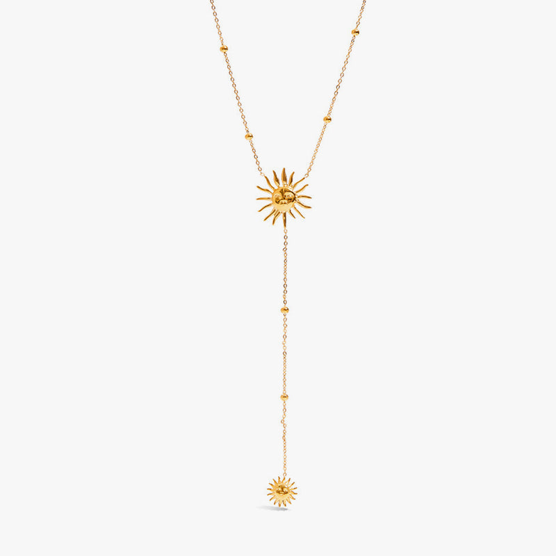 Y-shaped chain with a sun motif at the neck and a smaller sun drop