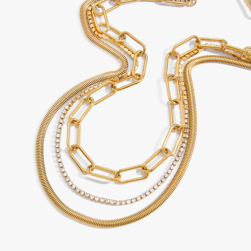 Layered snake, paperclip and crystal chains in gold tone
