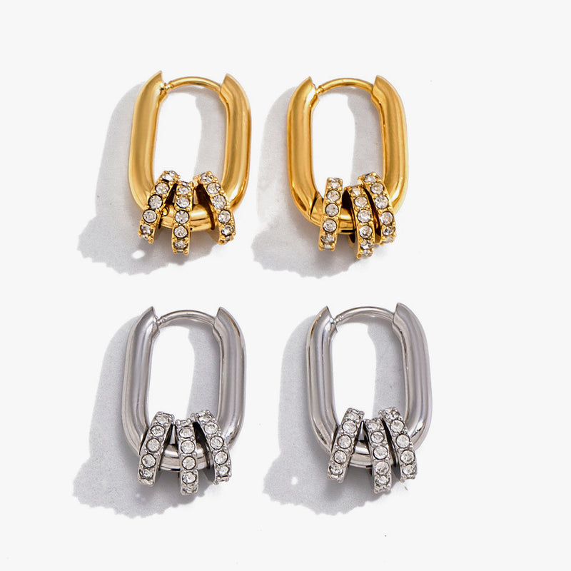 Oval huggies threaded with crystal-set rings, in gold and silver tone