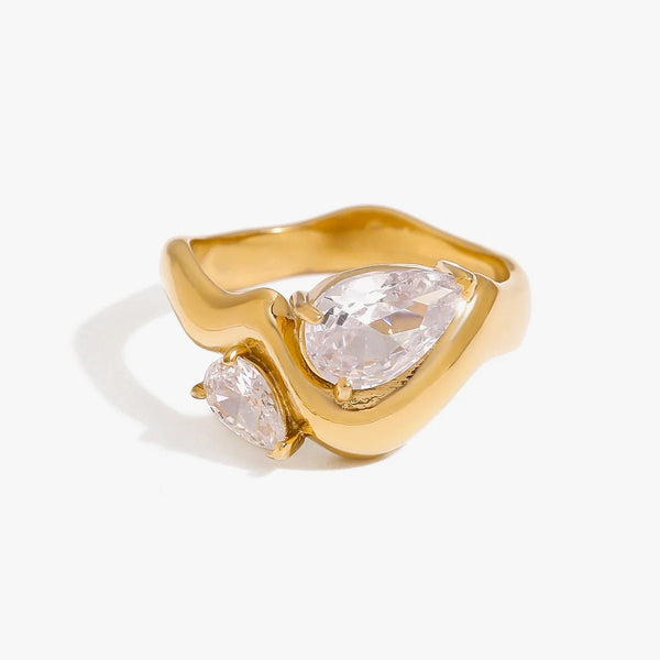 Sculpted band ring set with a pear and a round crystal