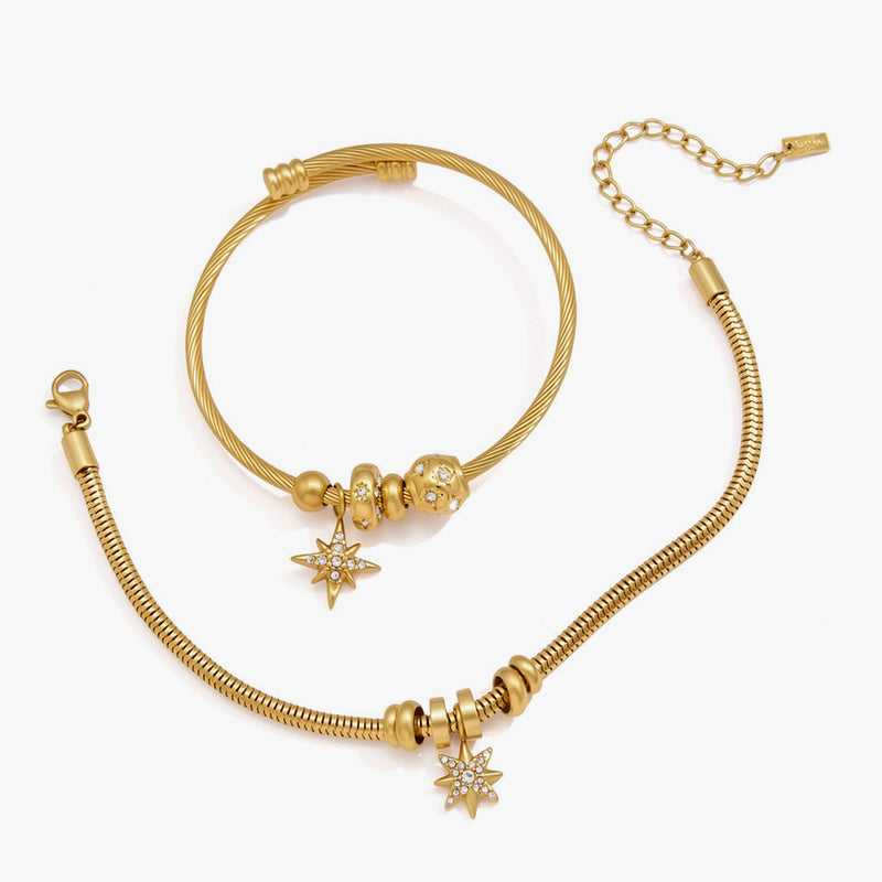 Bangle and snake chain bracelet with crystal starburst charms