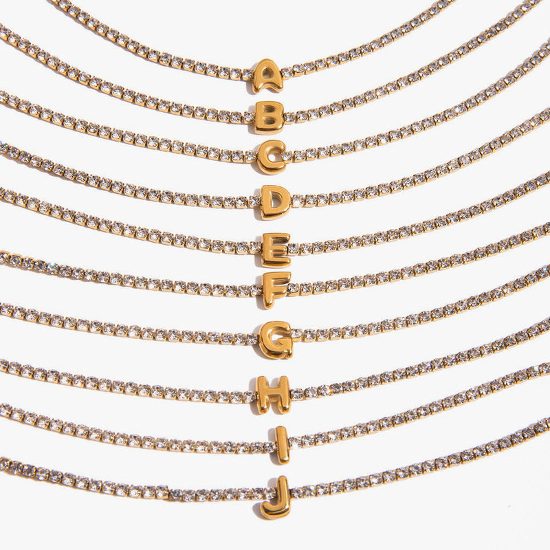 Crystal chain bracelets shown with initial letters from A to J