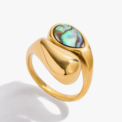 Chunky gold-tone ring set with an iridescent shell oval